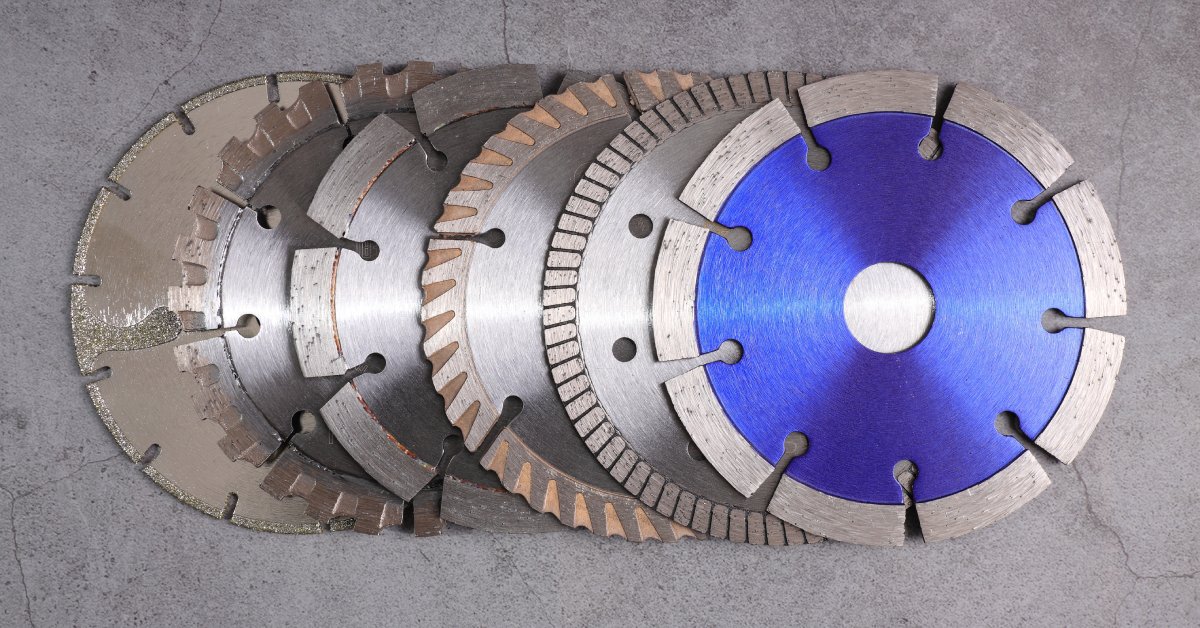  A series of diamond saw blades with various serrated edges are stacked and overlapping one another.