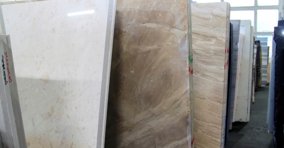 A close-up of different neutral-toned granite stones for countertops, walls, and various home upgrades.